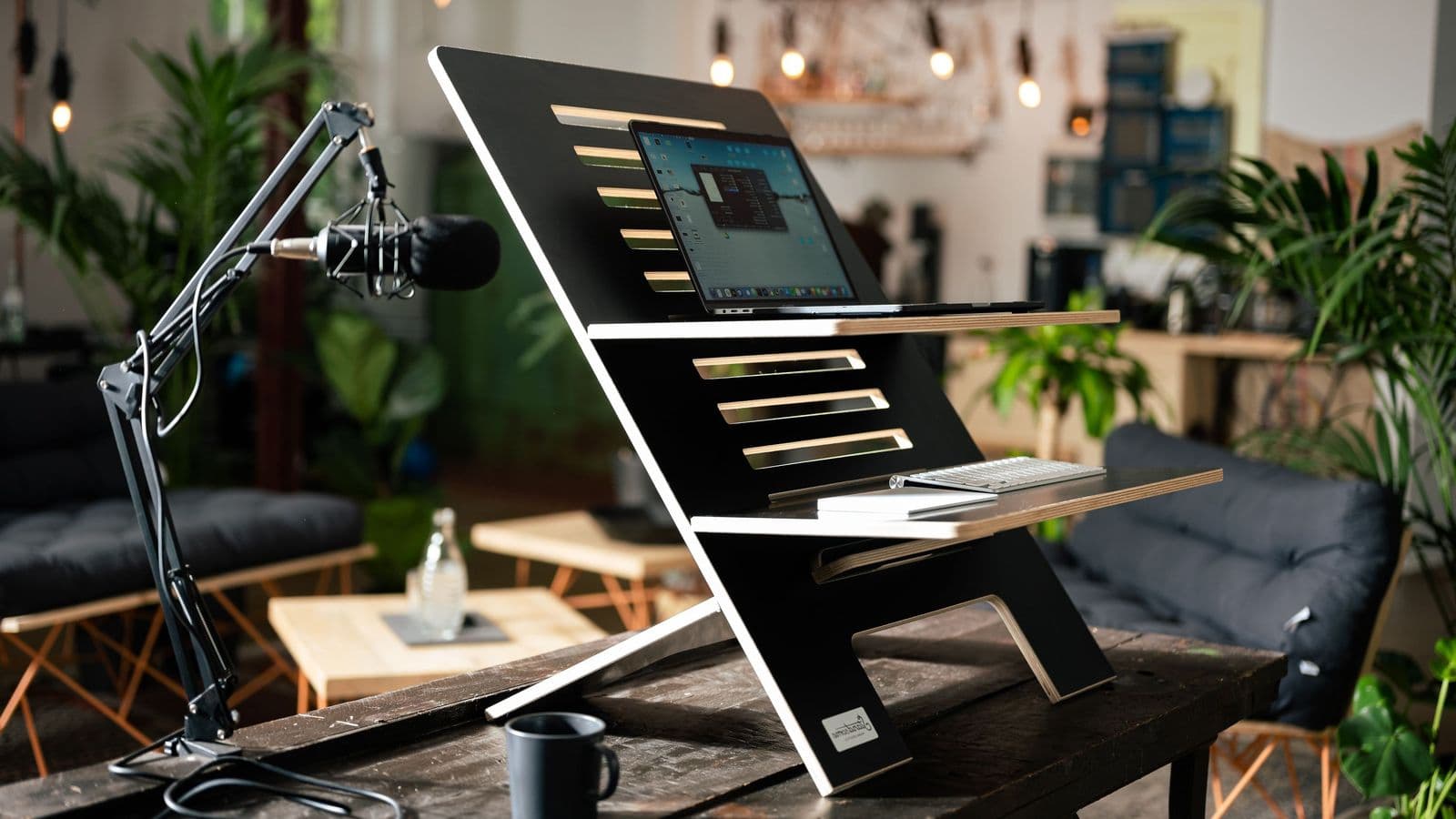 Modern desk with computer, chair, and ergonomic workspace accessories